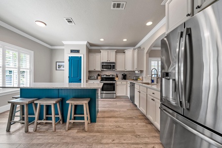 The kitchen features a large island with extra seating!