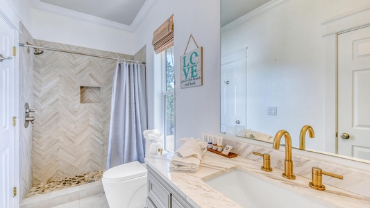 The second floor queen room shared access to an attached full-size bathroom!