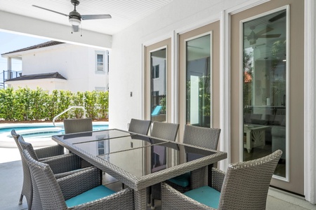 Wonderful outdoor patio dining area with ceiling fans!