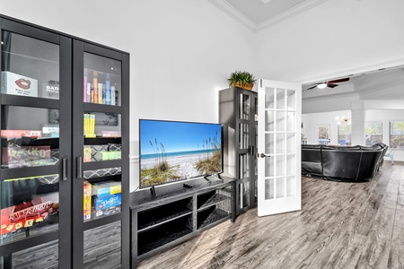 Unwind in the daybed room with entertainment center, games, and stunning ocean views on the large-screen TV.