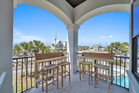 Look out to the beach or down to the pool from your high-top perch!