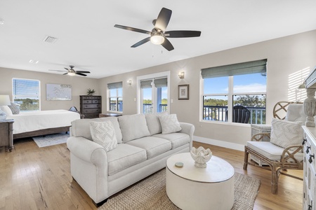 Relax in your spacious master suite where soft coastal colors and natural light create a serene atmosphere, while your private balcony beckons.