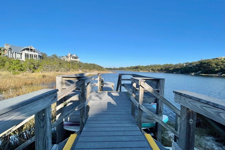 Enjoy a peaceful cup of coffee on the dock at the community's dune lake access!