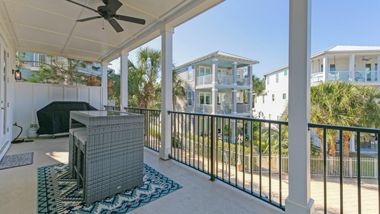 The living/kitchen balcony includes a large BBQ grill and high-top table!