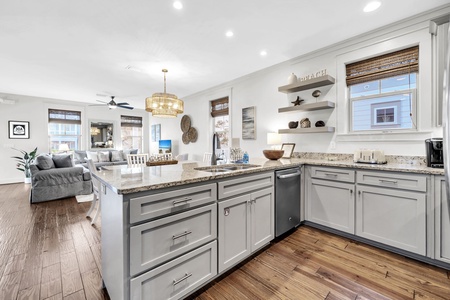 Gather around this beautiful granite island where you can prep meals while staying connected to your group relaxing nearby.