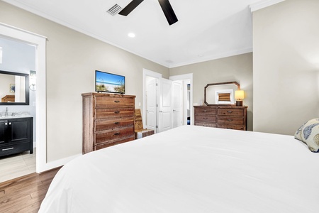 Sink into crisp white linens in your serene master bedroom, complete with warm wood furnishings and your own flat-screen TV for cozy nights in.