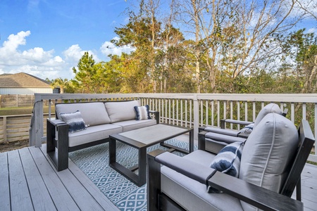 Settle into your private deck's plush seating with coffee in hand, watching treetops sway in the morning breeze.