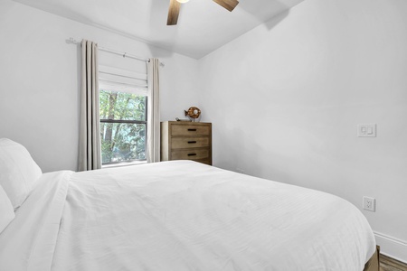 The guest bedroom features a king bed, with full bathroom right next door!