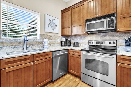 Your fully equipped kitchen features warm wood cabinets, granite counters, and stainless appliances for effortless meal prep.