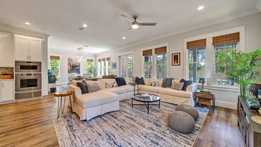 A large and comfy living space leads out to the pool!