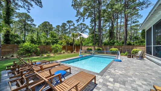 Soak up the sun on teak loungers at the pool deck!