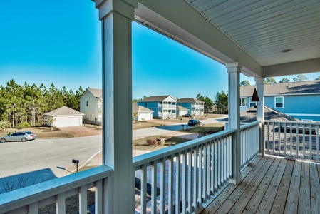 The master bedroom features a king-size platform bed, private bathroom, and private balcony!