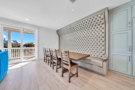 The dining table has plenty of seating with a unique built-in custom bench!