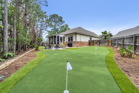 Practice your putting on a private backyard mini golf green, then relax on the screened porch surrounded by lush landscaping and peaceful wooded views.