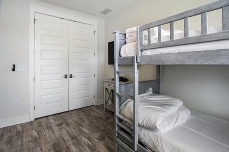 The bunk room includes 4 twins situated in two bunks!