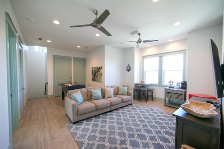 On the third floor, you'll find a family room with a flat screen TV, foosball table, and mini-fridge!