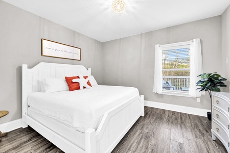 The king guest room with plenty of space and forest views.