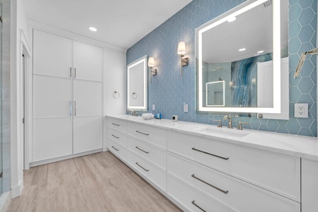 Large dual vanities in the ground floor king suite bathroom!