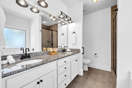 The master bathroom includes dual-vanities, a soaking tub, and a walk-in shower!