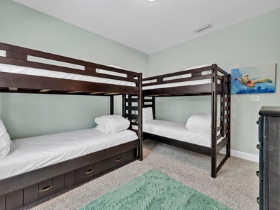 The bunk room features 2 twin bunks plus a trundle bed!
