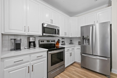 The chef in your family will appreciate the stainless appliances and quartz countertops!