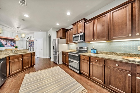 A fully stocked, spacious kitchen with breakfast bar!