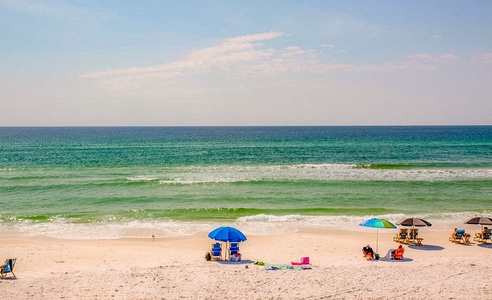 Pristine white sand beach with turquoise waters abound at the nearby beach access!