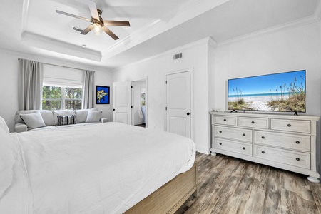 The master bedroom features a king size bed and a sofa for lounging (sofa sleeper not included).
