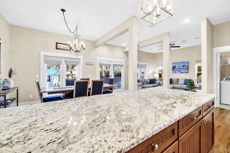 Your spacious kitchen island flows into elegant dining and living areas, perfect for gathering with loved ones.