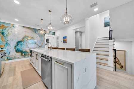 The kitchen is well stocked and features high-end finishes!