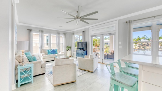 The main living room offers sweeping views of the pool!