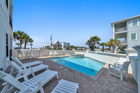 Oversized pool and sun deck!  Loungers and dining table!