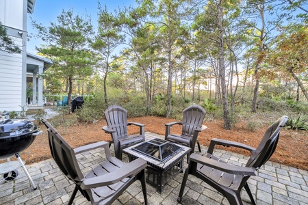 Gather around your private fire pit surrounded by peaceful woods, perfect for evening conversations and s'mores under the stars.