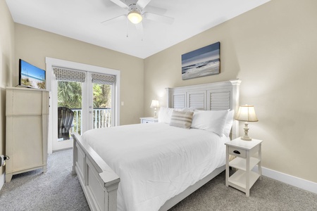 Sink into plush bedding and let the coastal breeze drift through French doors leading to your private balcony with lush tropical views.