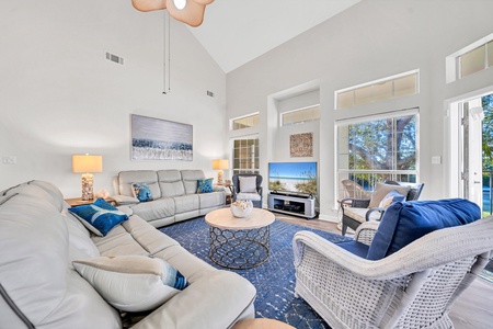 The open, inviting living room offers plentiful seating for all!