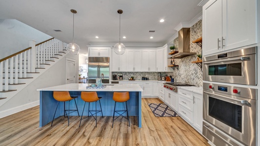 The kitchen island provides extra seating!