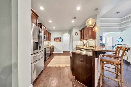 A fully stocked, spacious kitchen with breakfast bar!