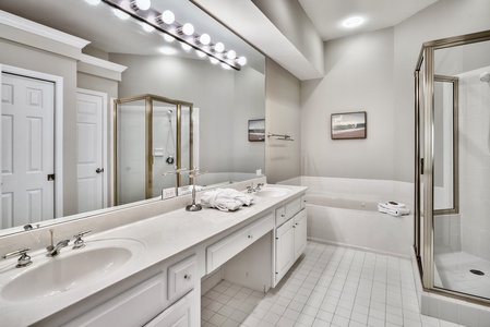 The master bath with dual vanities, soaking tub, and walk-in shower!
