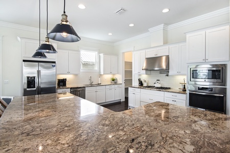 The kitchen features stainless appliances and high-end finishes!