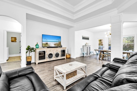 Sink into plush leather seating while enjoying your favorite shows on the large TV in this bright, open living space.