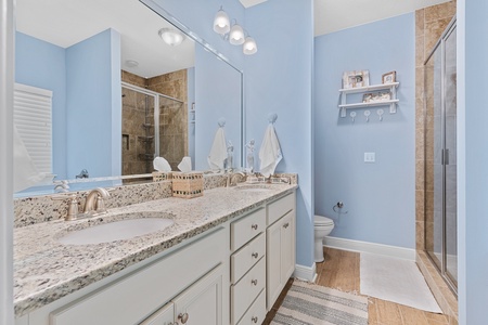 The master bath features dual sinks, a bathtub and walk-in shower!