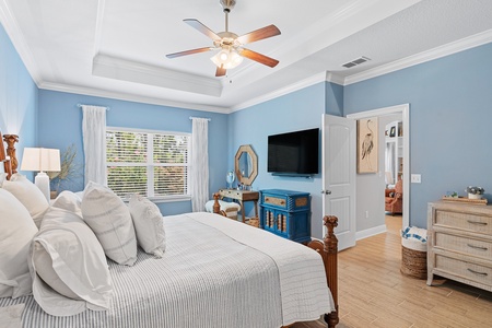 The master bedroom is well-appointed, and features forest views!