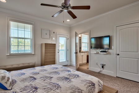 The master bedroom features a king-size platform bed, private bathroom, and private balcony!