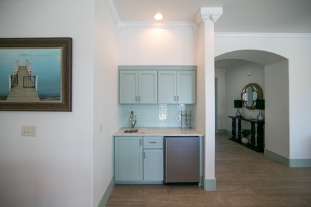 The wet bar features an additional refrigerator for drinks and food!