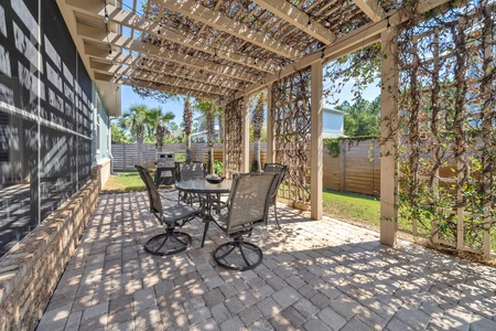 Back patio with shaded dining space and BBQ grill!
