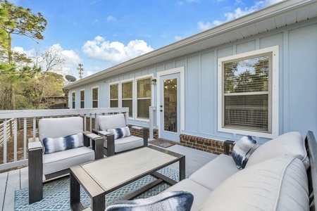 Relax on your private deck with plush seating and nature views, perfect for morning coffee or evening conversations.