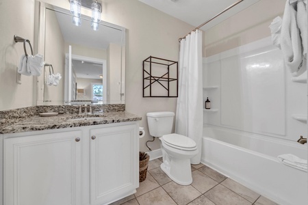 Full bathroom with tub for guests in the queen room and bunk room!