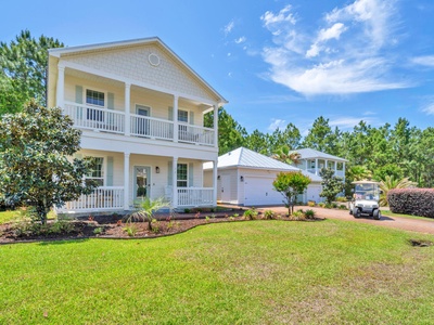 A peaceful beach cottage with golf cart, pool, and bikes!