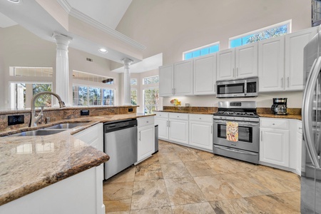 The kitchen is large, well-equipped and features a large island bar!