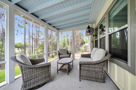 Relax in your screened porch with plush wicker seating, ceiling fan breezes, and peaceful wooded views—perfect for morning coffee or unwinding after a day of adventures.